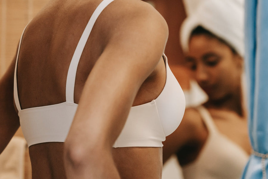 What causes back fat under bra?